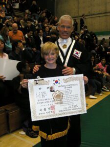 Master and Student holding certificate